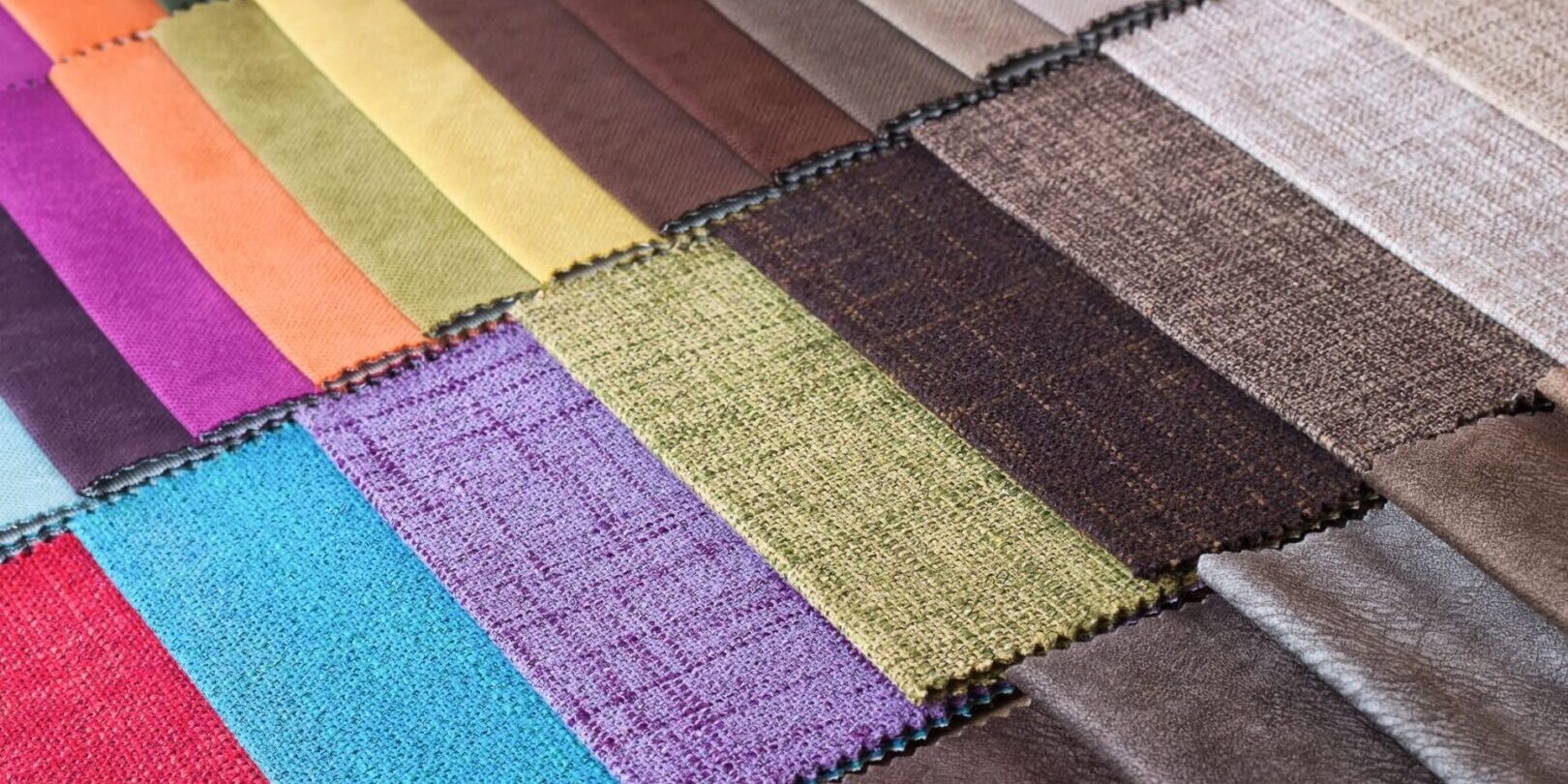 A close up of many different colored fabrics